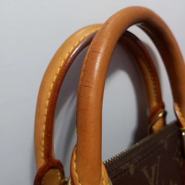 Professional repair of worn leather handbag handles