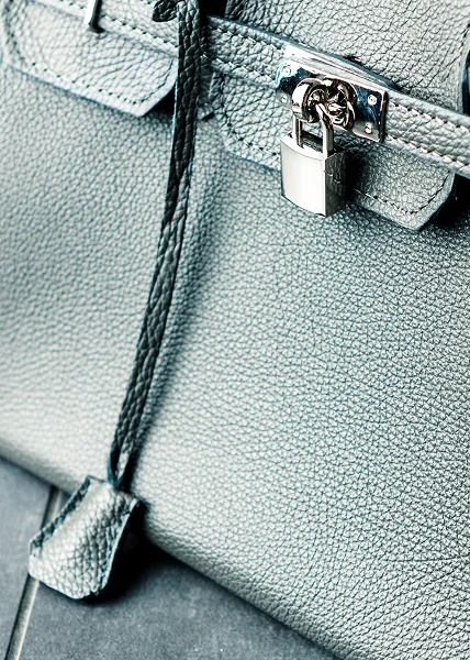 Leather Handbag Repair and Purse Restoration Leather handbag undergoing professional purse repair, strap restoration, and color refinishing